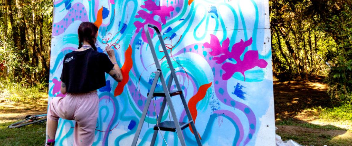 Girl painting on artwall